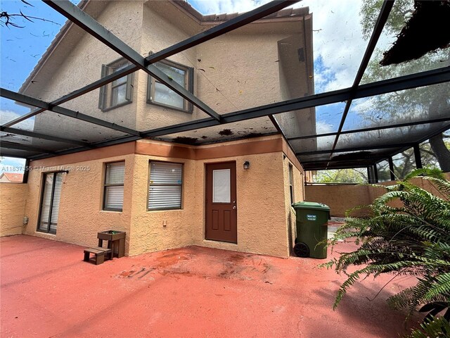 11236 SW 11th St, Pembroke Pines, FL 33025 - back of property featuring stucco siding and a patio