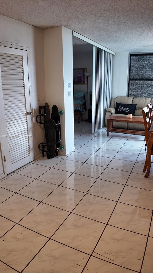 2899 Collins Ave Unit 821, Miami Beach, FL 33140 - hall with a textured ceiling