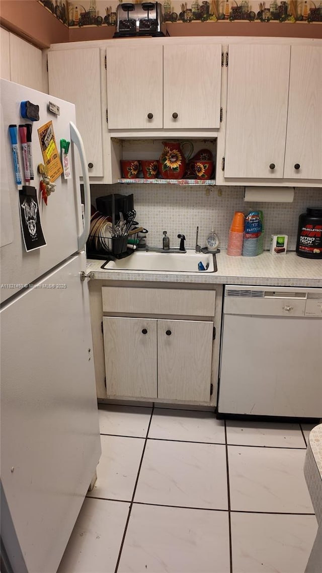 2899 Collins Ave Unit 821, Miami Beach, FL 33140 - kitchen with white appliances, light countertops, decorative backsplash, and open shelves