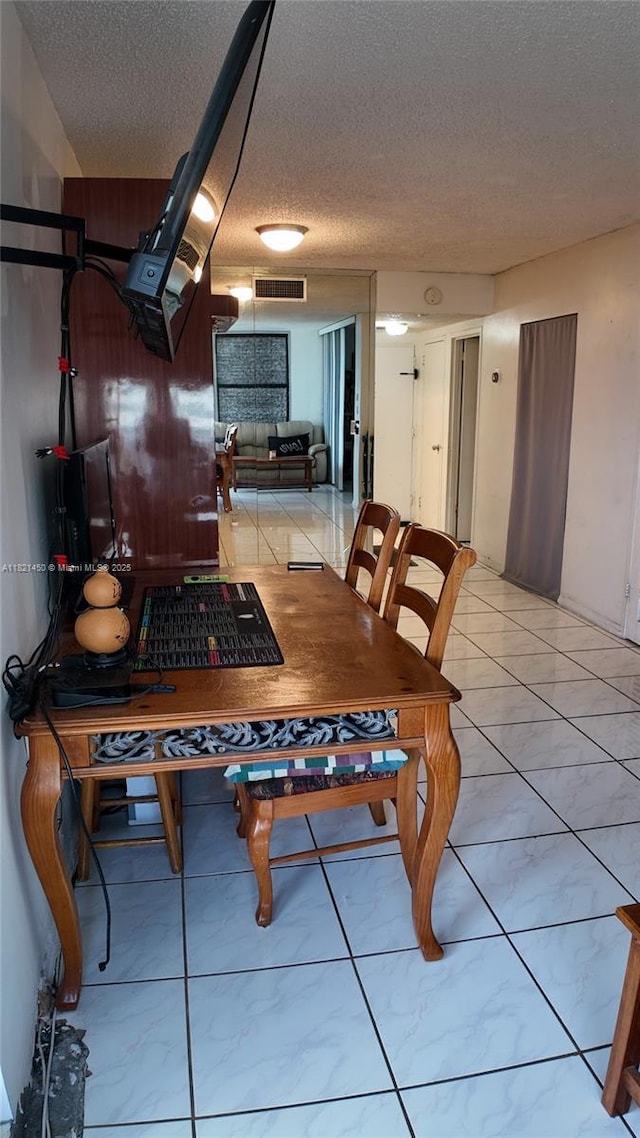 2899 Collins Ave Unit 821, Miami Beach, FL 33140 - dining area with a textured ceiling