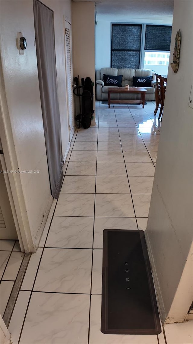 2899 Collins Ave Unit 821, Miami Beach, FL 33140 - hallway with light marble finish flooring