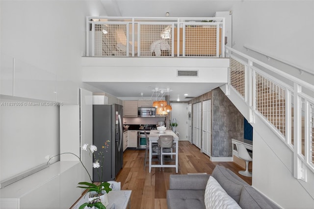 244 Biscayne Blvd Unit 446, Miami, FL 33132 - living area featuring wood finished floors and a high ceiling