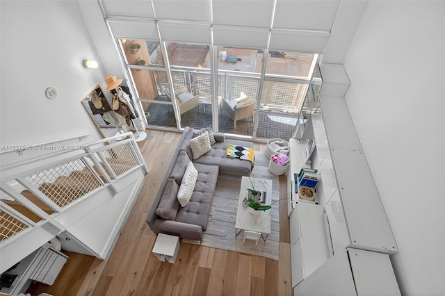 244 Biscayne Blvd Unit 446, Miami, FL 33132 - living room with wood finished floors, a wall of windows, and a towering ceiling