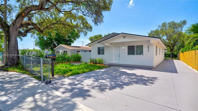 2820 NW 95th St, Miami, FL 33147 - bungalow-style home featuring driveway and stucco siding