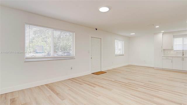 2820 NW 95th St, Miami, FL 33147 - spare room with light wood-style floors and recessed lighting