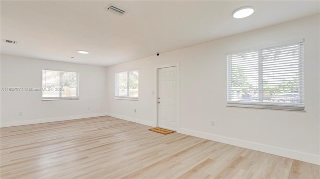 2820 NW 95th St, Miami, FL 33147 - spare room featuring light wood-style flooring and baseboards