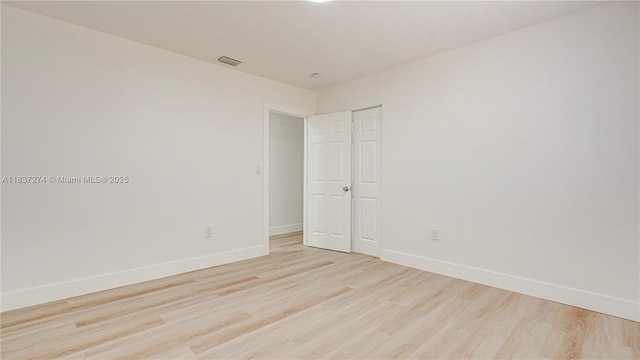 2820 NW 95th St, Miami, FL 33147 - spare room featuring light wood finished floors and baseboards