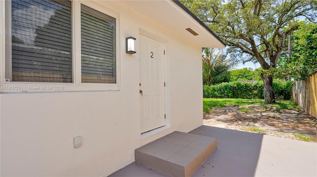 2820 NW 95th St, Miami, FL 33147 - entrance to property with stucco siding and a patio