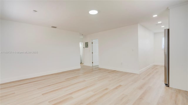 2820 NW 95th St, Miami, FL 33147 - empty room with light wood finished floors and recessed lighting