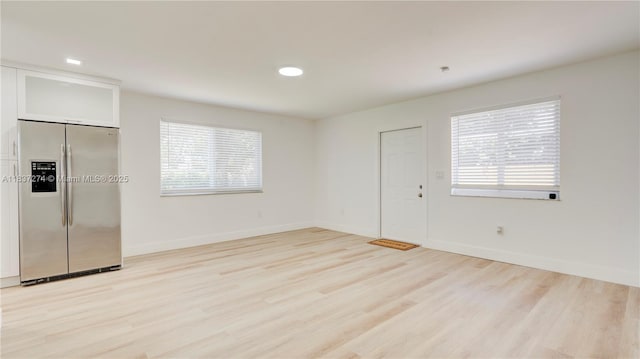 2820 NW 95th St, Miami, FL 33147 - entryway with light wood-type flooring and baseboards