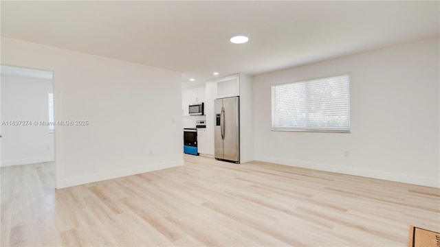 2820 NW 95th St, Miami, FL 33147 - empty room featuring light wood-type flooring and recessed lighting