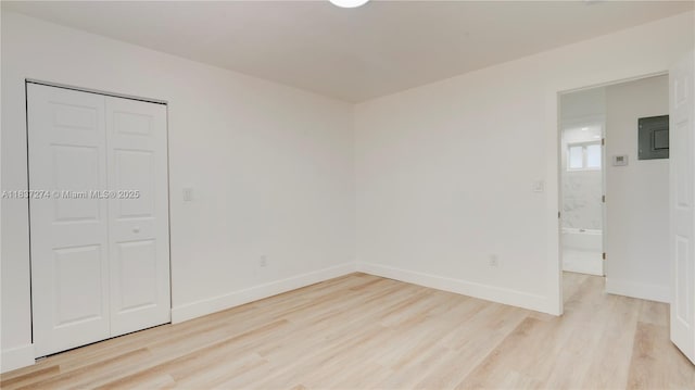 2820 NW 95th St, Miami, FL 33147 - spare room with light wood-style flooring and electric panel