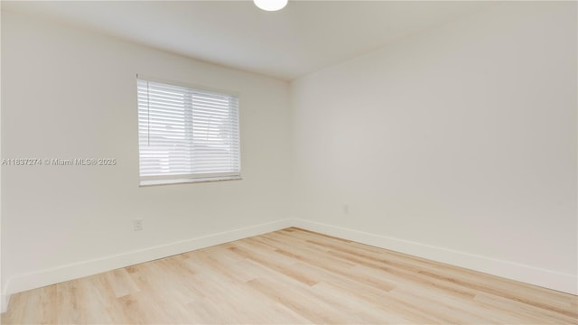 2820 NW 95th St, Miami, FL 33147 - empty room with baseboards and wood finished floors