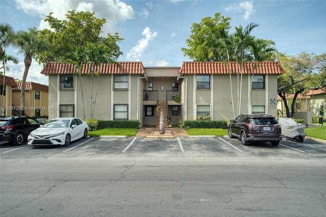 9730 Hammocks Blvd Unit 201-28, Miami, FL 33196 - view of building exterior with uncovered parking and stairs