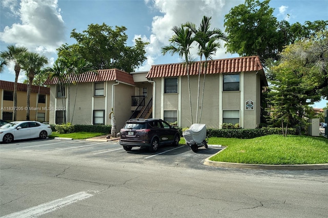 9730 Hammocks Blvd Unit 201-28, Miami, FL 33196 - view of building exterior featuring uncovered parking