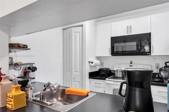 9730 Hammocks Blvd Unit 201-28, Miami, FL 33196 - kitchen featuring black microwave, white electric range, dark countertops, and white cabinets