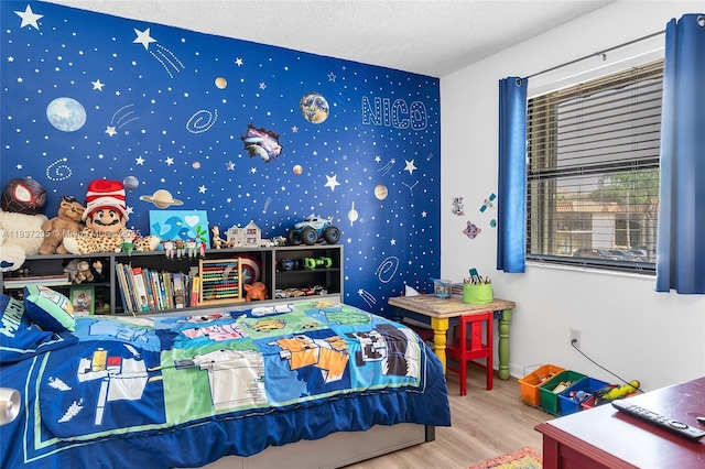9730 Hammocks Blvd Unit 201-28, Miami, FL 33196 - bedroom featuring wood finished floors, wallpapered walls, and a textured ceiling