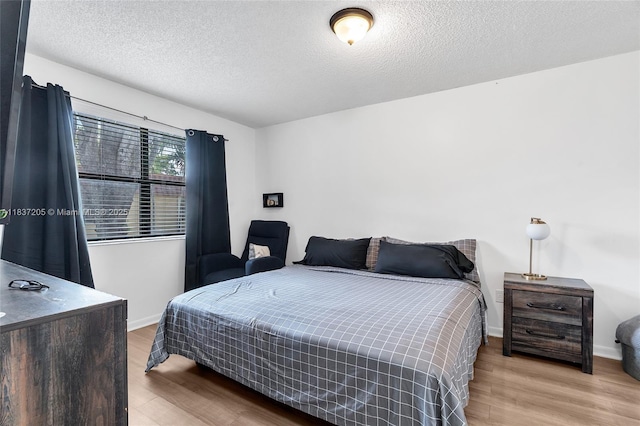 9730 Hammocks Blvd Unit 201-28, Miami, FL 33196 - bedroom with wood finished floors and a textured ceiling