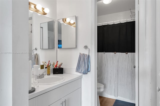 9730 Hammocks Blvd Unit 201-28, Miami, FL 33196 - full bathroom featuring vanity, wood finished floors, and a shower with curtain