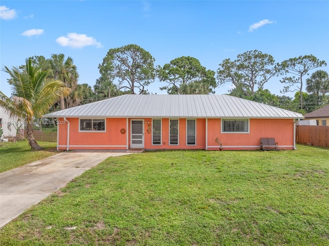 521 NE Dinner, Dinner, Palm Bay, FL 32907 - ranch-style house with a metal roof and driveway