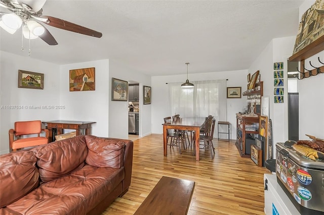 521 NE Dinner, Dinner, Palm Bay, FL 32907 - living area featuring a ceiling fan and light wood-type flooring