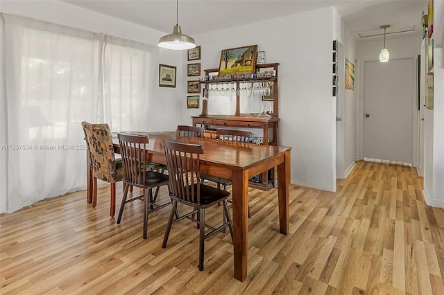 521 NE Dinner, Dinner, Palm Bay, FL 32907 - dining area with light wood finished floors and baseboards