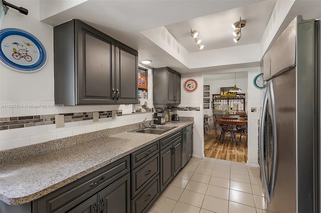 521 NE Dinner, Dinner, Palm Bay, FL 32907 - kitchen with appliances with stainless steel finishes, light tile patterned flooring, a tray ceiling, and light countertops