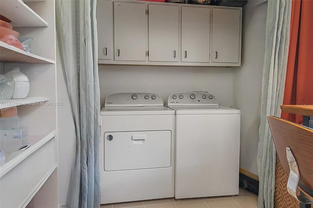 521 NE Dinner, Dinner, Palm Bay, FL 32907 - washroom featuring washing machine and dryer, cabinet space, and light tile patterned flooring