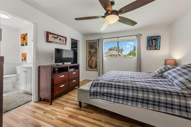 521 NE Dinner, Dinner, Palm Bay, FL 32907 - bedroom with light wood-style floors, ensuite bathroom, and a ceiling fan