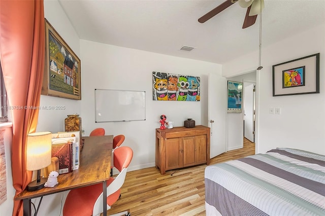 521 NE Dinner, Dinner, Palm Bay, FL 32907 - bedroom featuring light wood finished floors and ceiling fan