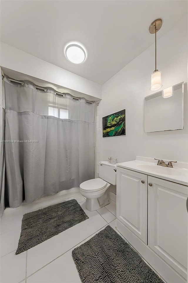 521 NE Dinner, Dinner, Palm Bay, FL 32907 - full bathroom featuring vanity, tile patterned floors, and a shower with curtain