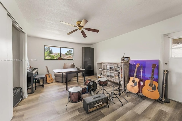 521 NE Dinner, Dinner, Palm Bay, FL 32907 - playroom with wood finished floors, a ceiling fan, and a textured ceiling
