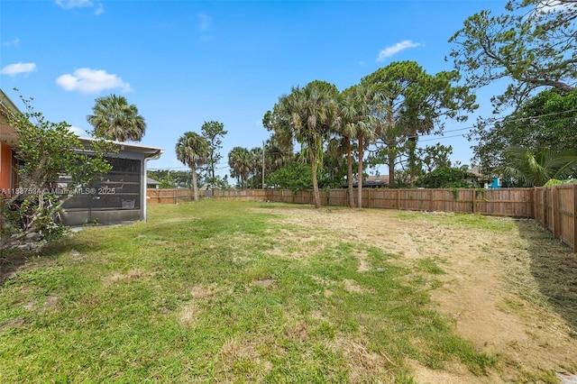 521 NE Dinner, Dinner, Palm Bay, FL 32907 - fenced backyard featuring a sunroom