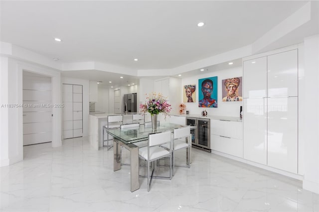 701 Brickell Key Blvd Unit 2011, Miami, FL 33131 - dining space with wine cooler, recessed lighting, bar area, and light marble finish flooring