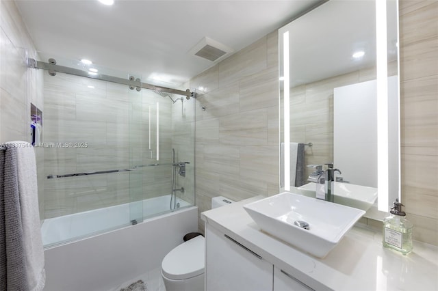 701 Brickell Key Blvd Unit 2011, Miami, FL 33131 - full bathroom with enclosed tub / shower combo, vanity, recessed lighting, and tile walls
