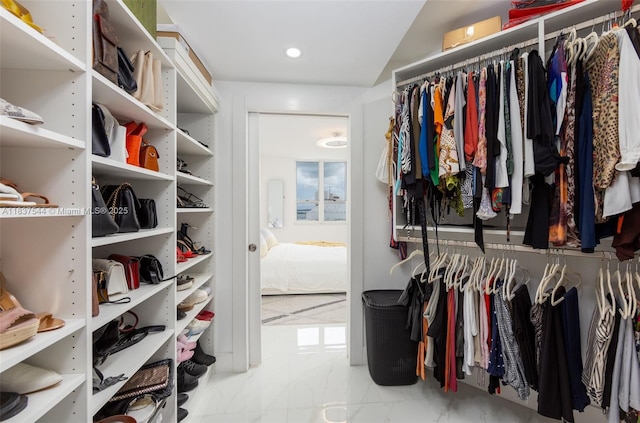 701 Brickell Key Blvd Unit 2011, Miami, FL 33131 - spacious closet featuring marble finish flooring and vaulted ceiling
