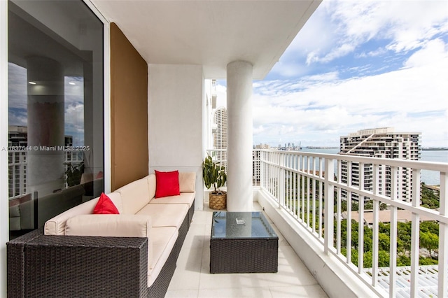 701 Brickell Key Blvd Unit 2011, Miami, FL 33131 - balcony featuring a water view and outdoor lounge area