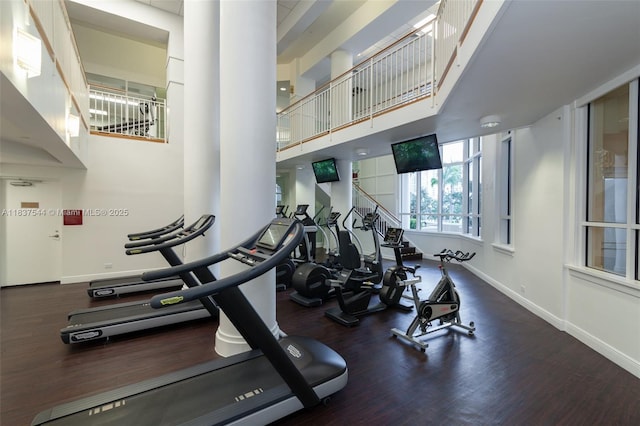 701 Brickell Key Blvd Unit 2011, Miami, FL 33131 - gym with wood finished floors and a high ceiling