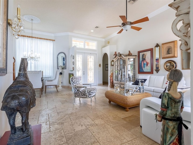 3043 Lakewood Dr, Weston, FL 33332 - living area featuring a chandelier, arched walkways, crown molding, a ceiling fan, and a high ceiling