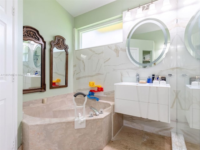 3043 Lakewood Dr, Weston, FL 33332 - full bathroom featuring vanity, a garden tub, a marble finish shower, and tile walls
