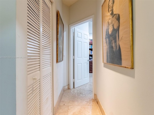 3043 Lakewood Dr, Weston, FL 33332 - hall with baseboards and light stone finish floors