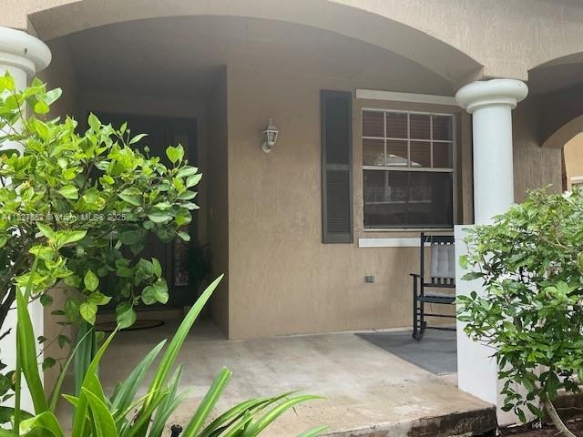 4603 Highgate Dr Unit C, Delray Beach, FL 33445 - entrance to property with stucco siding