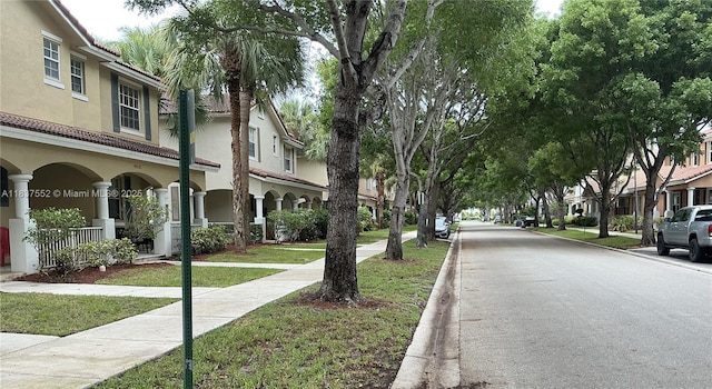4603 Highgate Dr Unit C, Delray Beach, FL 33445 - view of asphalt street with curbs, a residential view, and sidewalks