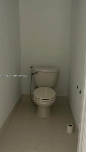 4603 Highgate Dr Unit C, Delray Beach, FL 33445 - bathroom featuring toilet and tile patterned floors