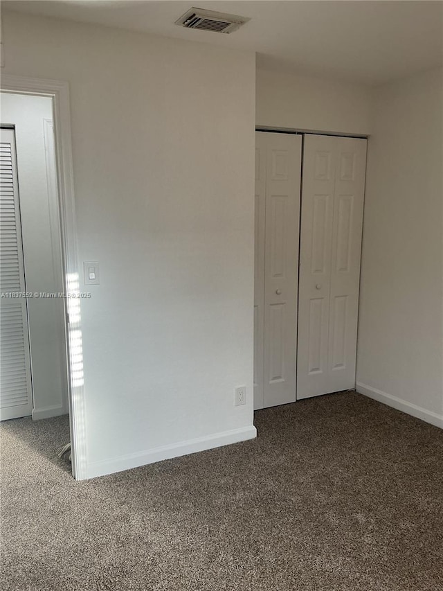 4603 Highgate Dr Unit C, Delray Beach, FL 33445 - unfurnished bedroom with carpet floors and a closet