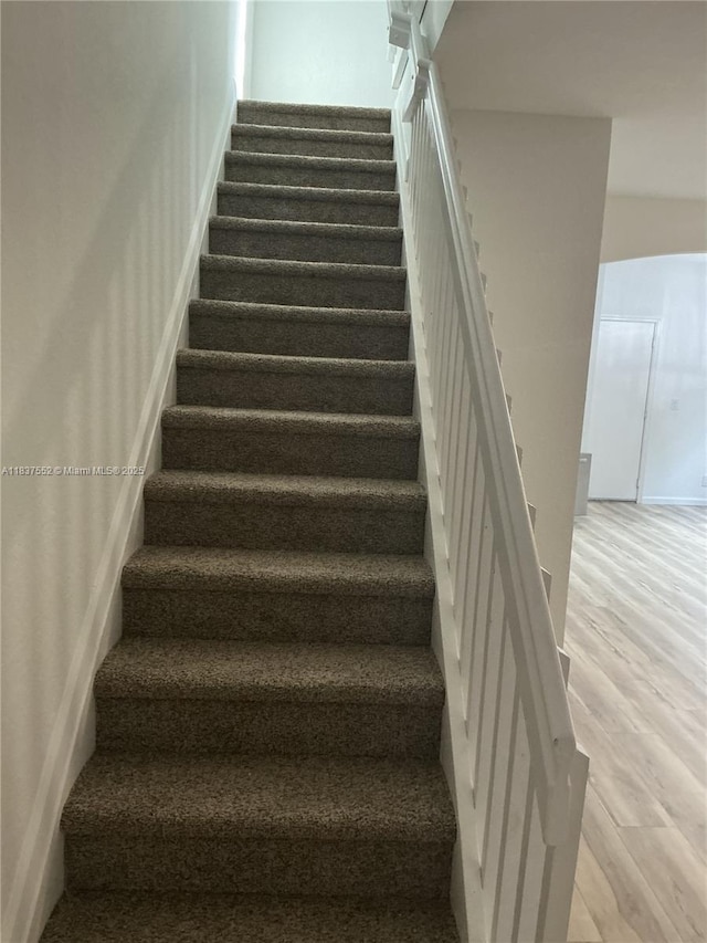 4603 Highgate Dr Unit C, Delray Beach, FL 33445 - staircase featuring wood finished floors