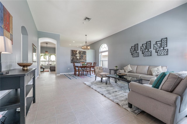 1122 NW 143rd Ave, Pembroke Pines, FL 33028 - living area with light tile patterned floors, arched walkways, healthy amount of natural light, a chandelier, and recessed lighting
