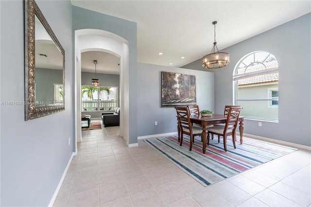 1122 NW 143rd Ave, Pembroke Pines, FL 33028 - dining space with light tile patterned floors, a chandelier, arched walkways, and recessed lighting