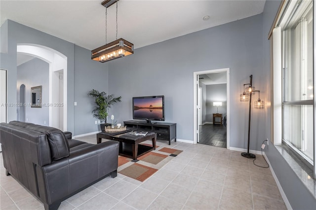 1122 NW 143rd Ave, Pembroke Pines, FL 33028 - living room featuring arched walkways and light tile patterned floors