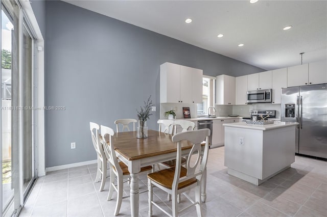1122 NW 143rd Ave, Pembroke Pines, FL 33028 - dining area with recessed lighting and light tile patterned floors